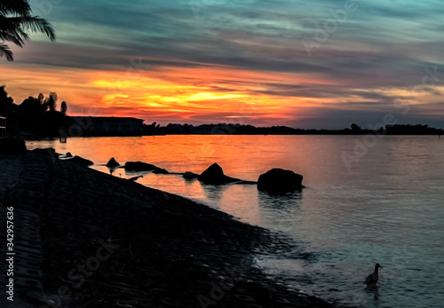 sunset over the bay  orange  blue  skyline  reflection  dusk  horizon  rocks  cloud  beautiful  seascape