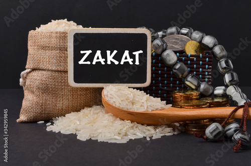 Islamic zakat concept. A contribution structure for Muslims or moslems to help the poor and needy. Conceptual shoot for property, income and fitrah zakat. photo