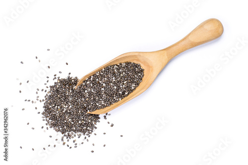 Chia seeds ( Salvia hispanica ) in wooden spoon isolated on white background. Healthy food or superfood and supplement concept. Top view. Flat lay.
