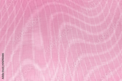 abstract background: unique wavy pattern of overlaying two grids, blurred and tinted to the color of the living coral