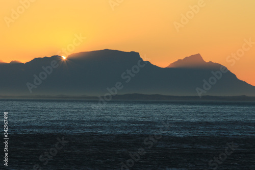 Sunset view of the Table Mountain from Gordons Bay of Cape Town