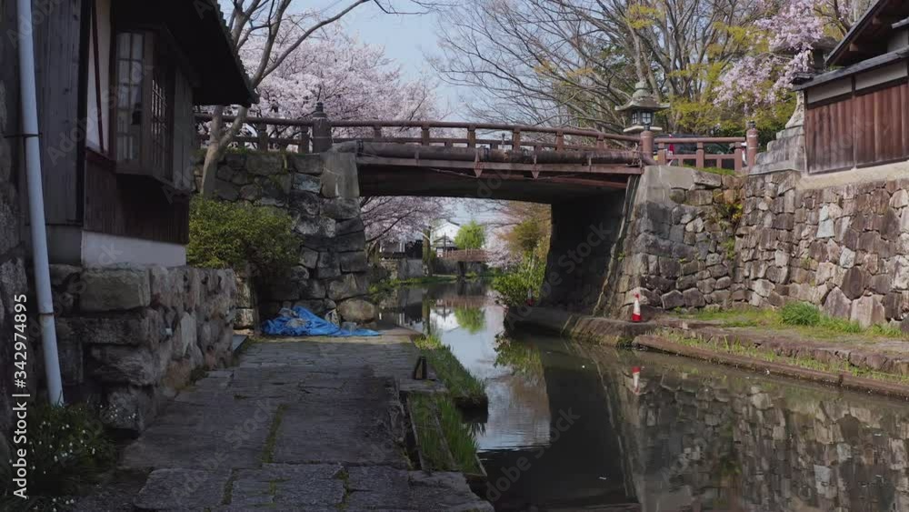 Omihachiman Moat, Pan across ancient stone canal in Spring, Japan Omihachiman Moat, Pan across ancient stone canal in Spring, Japan