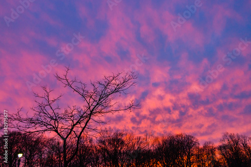 sunset illuminating clouds above a field © Gottography