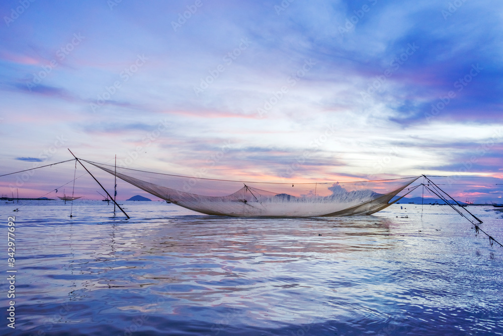 Fototapeta premium Fisherman worked in fishing village of Cua Dai, Hoi An, Vietnam. Hoian is recognized as a World Heritage Site by UNESCO.