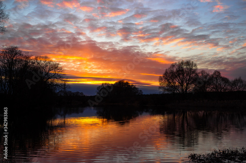 Colorful multicolor sunset over the river  © PhotoChur