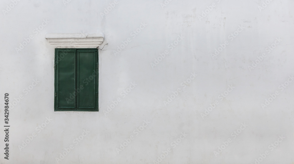 Green old window and white walls with copy space for your text or image. Green old window and white walls with copy space for your text or image.