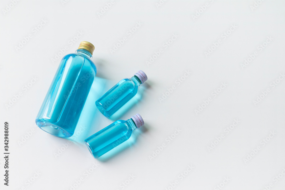 Glasses, alcohol-based hand sanitizers, 70% isopropyl alcohol, must have items product during the COVID- 19 pandemic, isolated on white background. Glasses, alcohol-based hand sanitizers, 70% isopropyl alcohol, must have items product during the COVID- 19 pandemic, isolated on white background.
