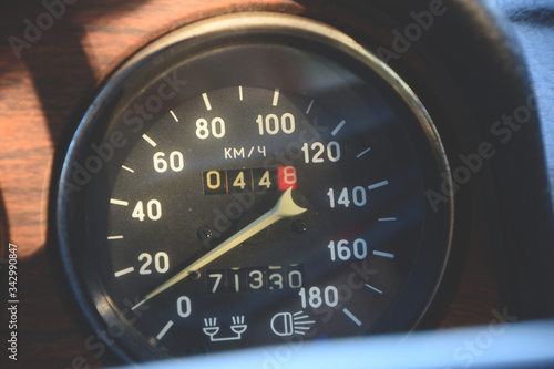 Closeup on a speedometer of a vintage car