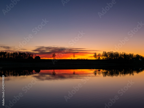 beautiful sunset by the lake, bright colors © ANDA