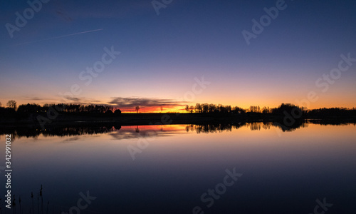 beautiful sunset by the lake, bright colors