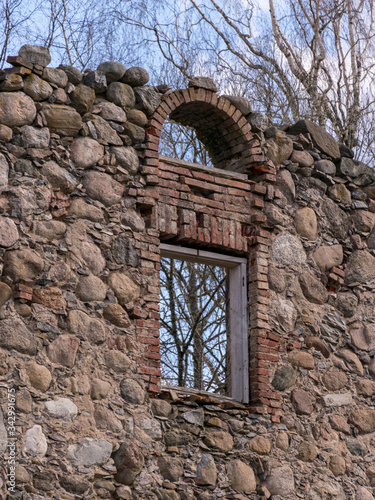 Wooden window in a stoned wall