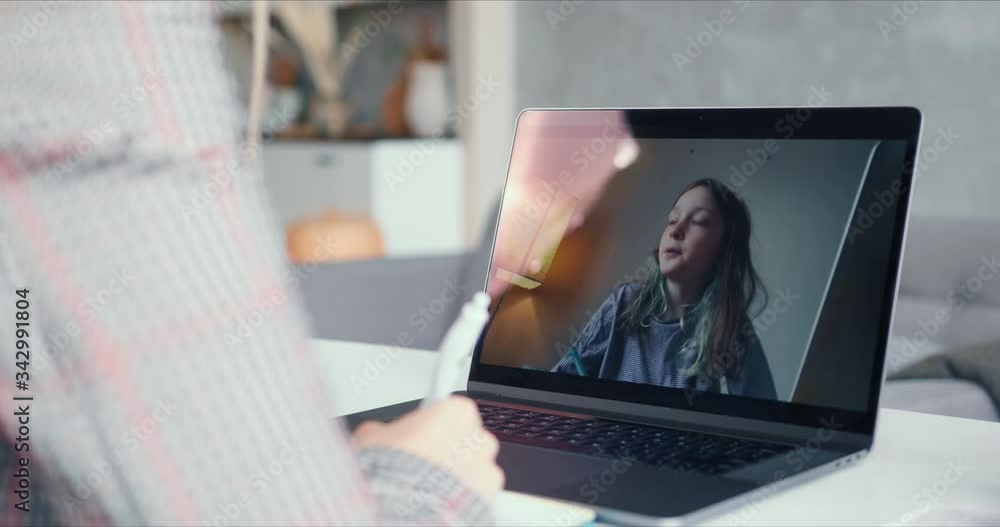 POV female tutor speaking to happy teenage girl while leading online class from home using laptop web conference call. POV female tutor speaking to happy teenage girl while leading online class from home using laptop web conference call.