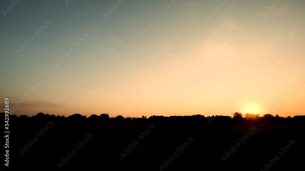 Silhouette Children ride bicycles at sunset Silhouette Children ride bicycles at sunset