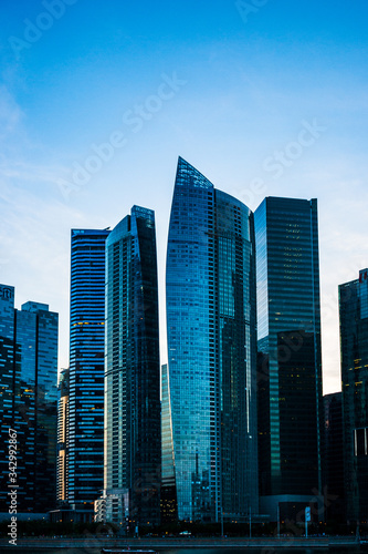 Sunset over some buildings in Marina Bay  Singapore skyline.