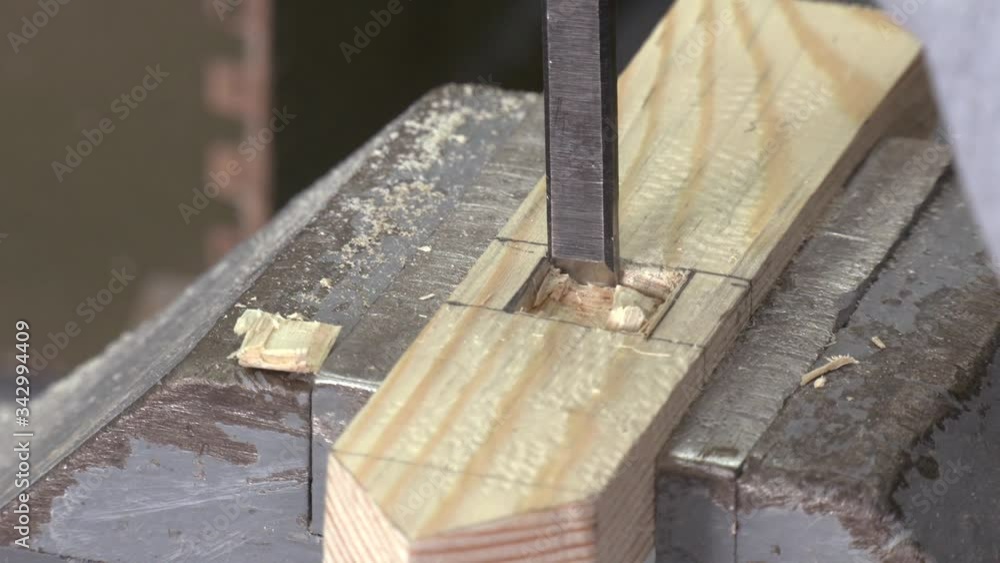Carpenter at Work with Hammer and Chisel. Carpenter working with a chisel and hammer in a wooden workshop. Profession, carpentry and manual woodwork concept.
Carpenter at Work with Hammer and Chisel. Carpenter working with a chisel and hammer in a wooden workshop. Profession, carpentry and manual woodwork concept.