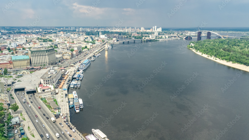 Aerial top view of Kyiv cityscape, Dnieper river and Podol historical district skyline from above, city of Kiev, Ukraine

