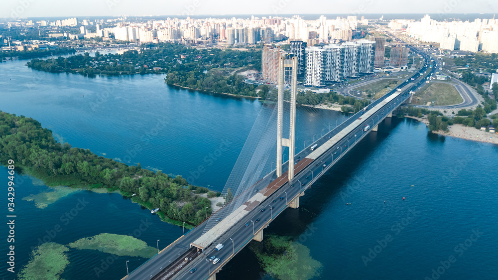Aerial top view of South Bridge in Kiev city from above, Kyiv skyline and Dnieper river cityscape, Ukraine
