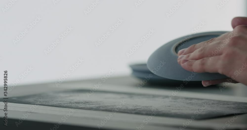 Slow motion man hands check bottom of blue ceramic saucer Slow motion man hands check bottom of blue ceramic saucer