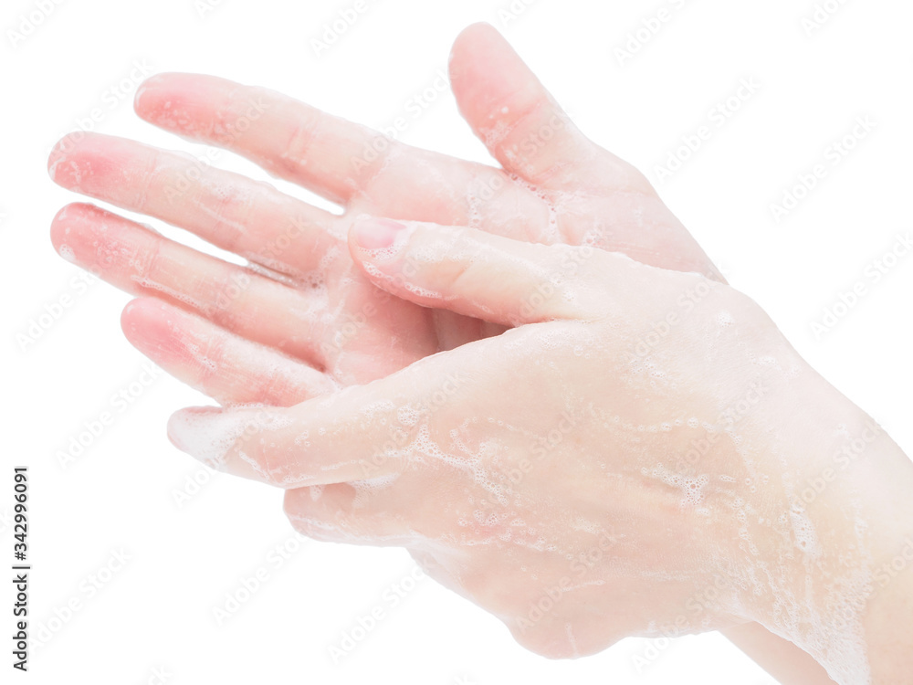 Hands in soap suds on a white background, close-up. Prevention and precautions for the coronavirus, influenza and SARS pandemic. The concept of disinfection with hand washing with soap Hands in soap suds on a white background, close-up. Prevention and precautions for the coronavirus, influenza and SARS pandemic. The concept of disinfection with hand washing with soap