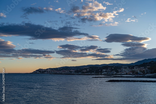 Clouds of contrasting color over the evening city