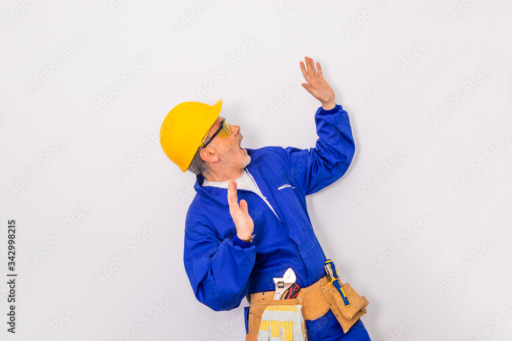 construction worker or worker with tools isolated on background with copy-space construction worker or worker with tools isolated on background with copy-space