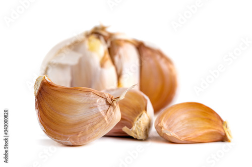 Garlic bulbs and cloves isolated on white background © k_samurkas