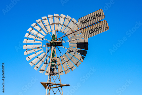 Southern Cross windmill on outskirts of town. Close-up of head and tail, with blue sky behind. Morawa, Western Australia.