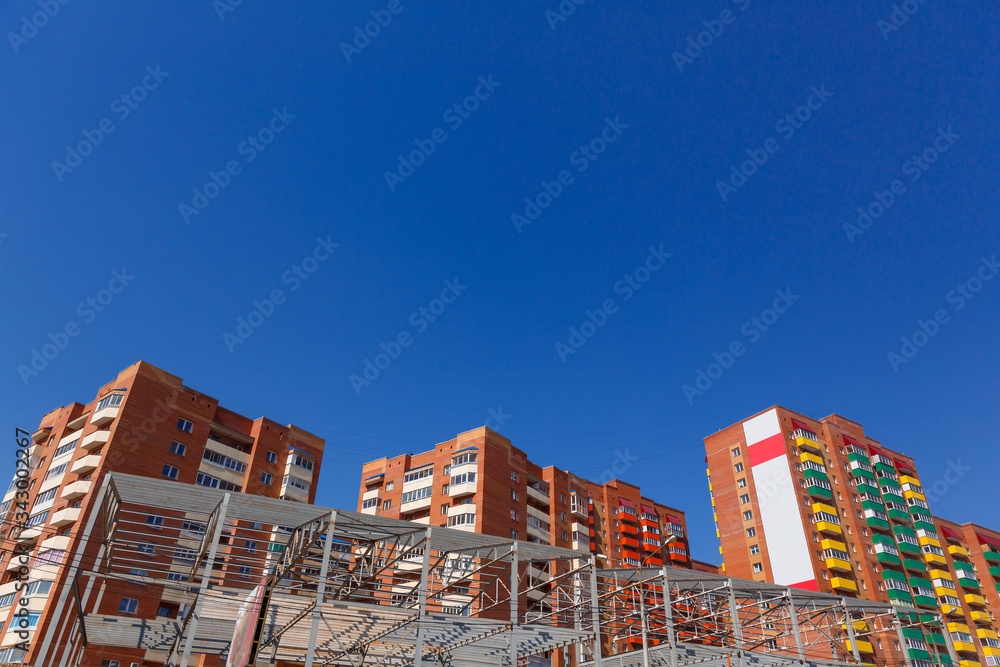 Residential buildings on a background of blue sky