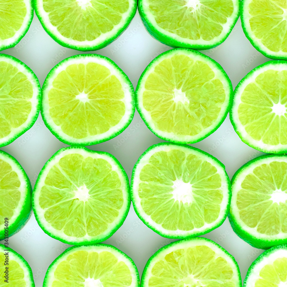 Green background with citrus-fruit of lime slices on white background, Lemon texture
Green background with citrus-fruit of lime slices on white background, Lemon texture