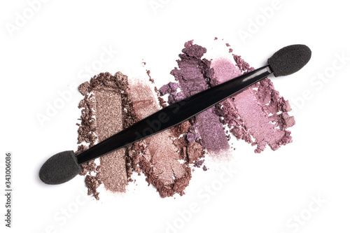 Close-up of make-up swatch. Smear of crushed brown and purble eye shadow photo