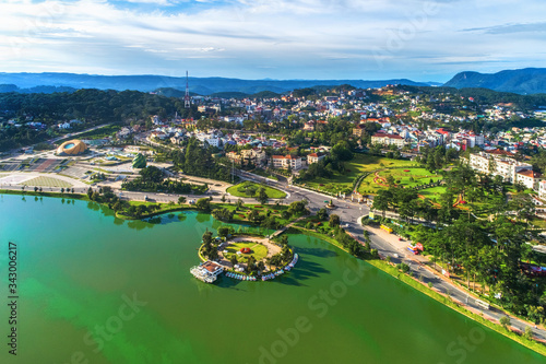  Top view aerial photo from flying drone of a Da Lat City with development buildings, transportation. Tourist city in developed Vietnam. 