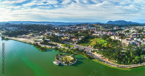  Top view aerial photo from flying drone of a Da Lat City with development buildings  transportation. Tourist city in developed Vietnam. 