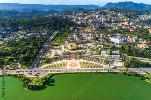 Top view aerial photo from flying drone of a Da Lat City with development buildings, transportation. Tourist city in developed Vietnam. Center Square of Da Lat city
