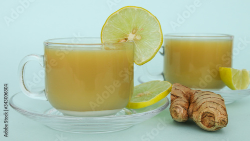 Nutritious Ginger juice with lemon in a cup and saucer