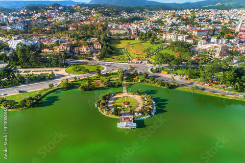  Top view aerial photo from flying drone of a Da Lat City with development buildings, transportation. Tourist city in developed Vietnam. 