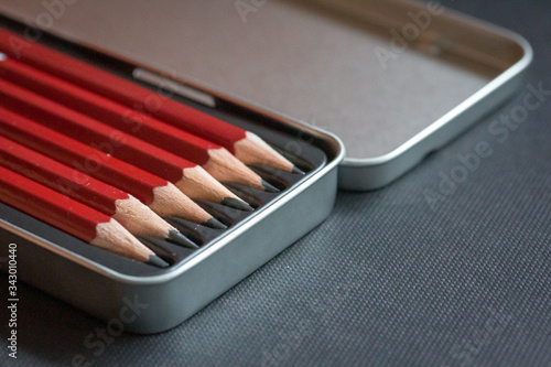 Close up of a set of pencils in a metal box