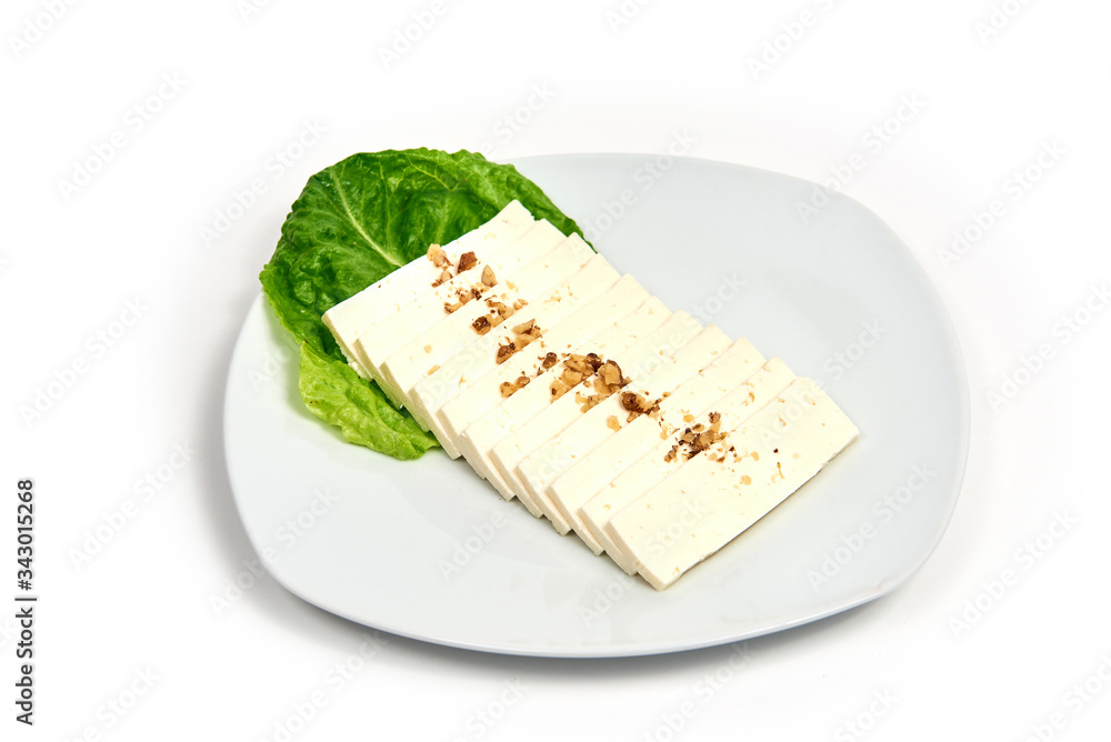 Cheese on a plate on white background.