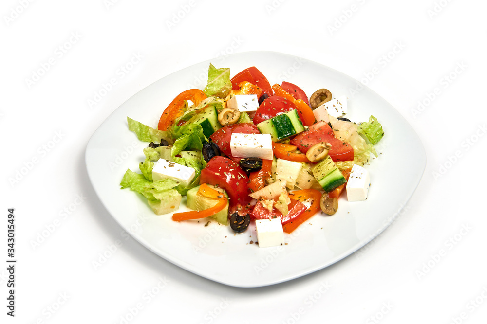 Plate with greek salad isolated on white background