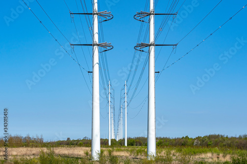 A long line of new high-voltage pylons in the Bentwoud near Zoetermeer, the Netherlands