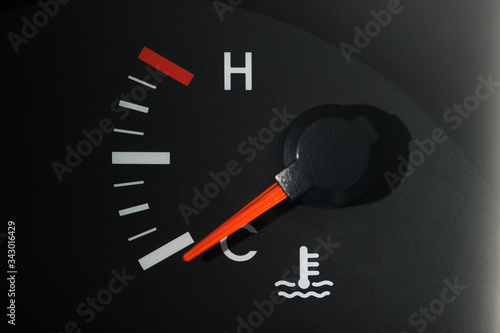 The car's coolant temperature indicator on the dashboard, a little color, shows the minimum temperature.