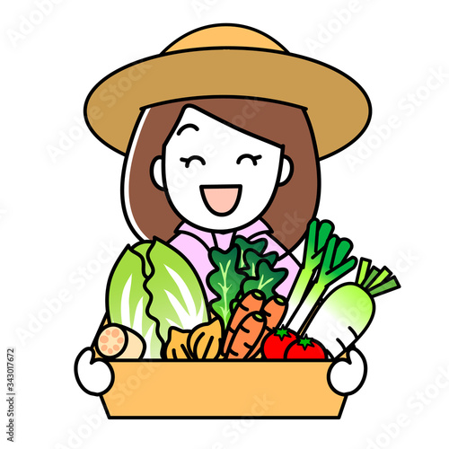 野菜の詰め合わせセットを持っている女性