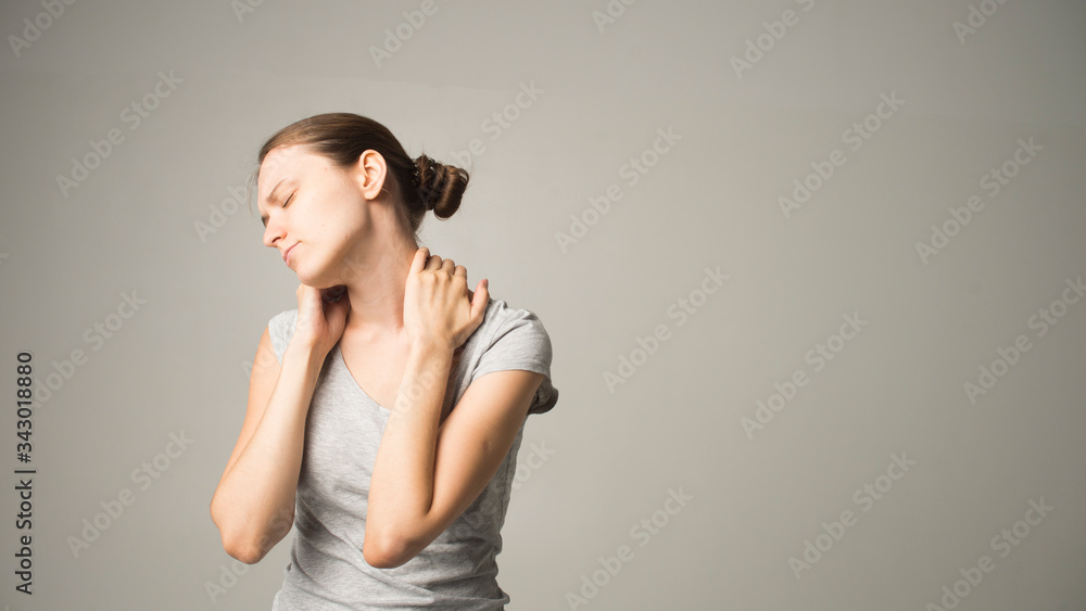 woman feeling neck pain, massaging tense muscles woman feeling neck pain, massaging tense muscles