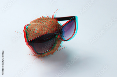 Creative fashion concept. Coconut with sunglasses on white background. Glitch effect © splitov27