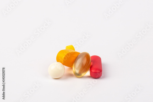 Close up of medicines pills and tablets on white background.