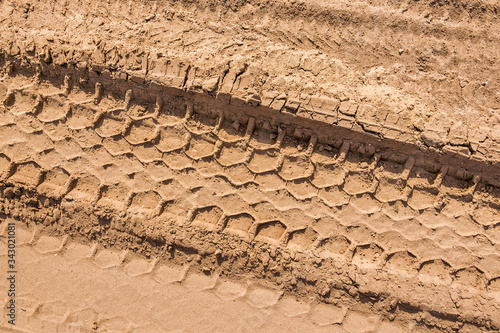 Car footprints in the sand