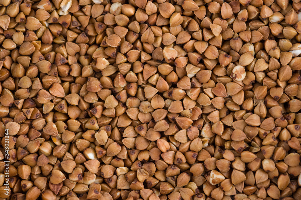 Scattered buckwheat background / Close-up buckwheat background. Scattered buckwheat background / Close-up buckwheat background.
