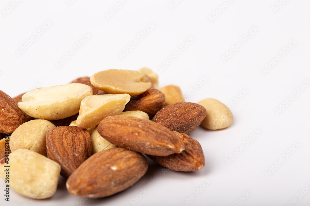 Healthy nuts on White Background. Nuts are a snack food consisting of any mixture of mechanically or manually combined nuts. Healthy nuts on White Background. Nuts are a snack food consisting of any mixture of mechanically or manually combined nuts.
