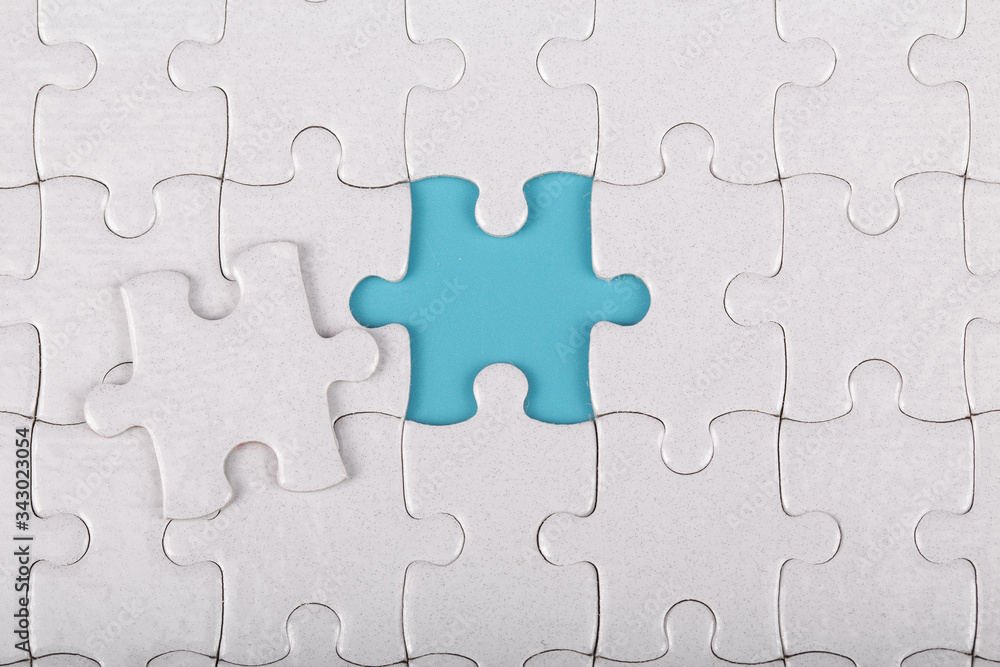 The last piece of white jigsaw puzzle. The last piece of white jigsaw puzzle.