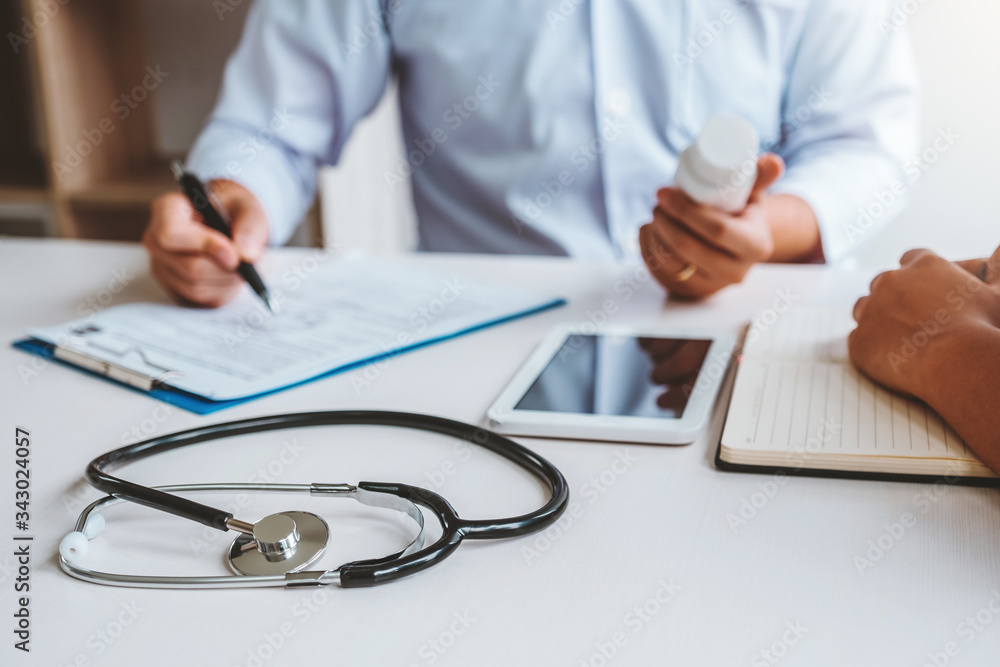 Doctors and patients Consulting about Treatment guidelines at office