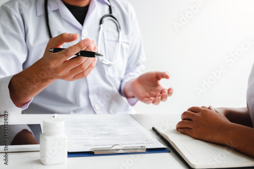 Doctors and patients Consulting about Treatment guidelines at office